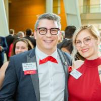 Guests posing in the Grand Gallery before the Enrichment Dinner